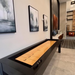 a game room with shuffleboard