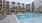 a pool in a courtyard between buildings