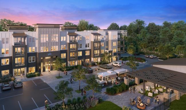 a building with a parking lot and people walking around