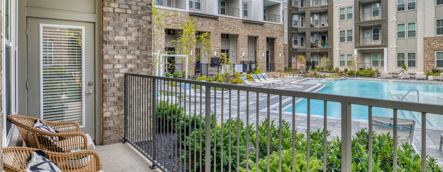 a spacious poolside patio