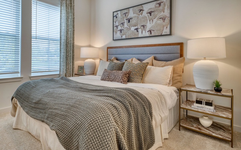 Bedroom with natural lighting and high ceilings