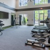 fitness area with treadmills and ceiling lighting