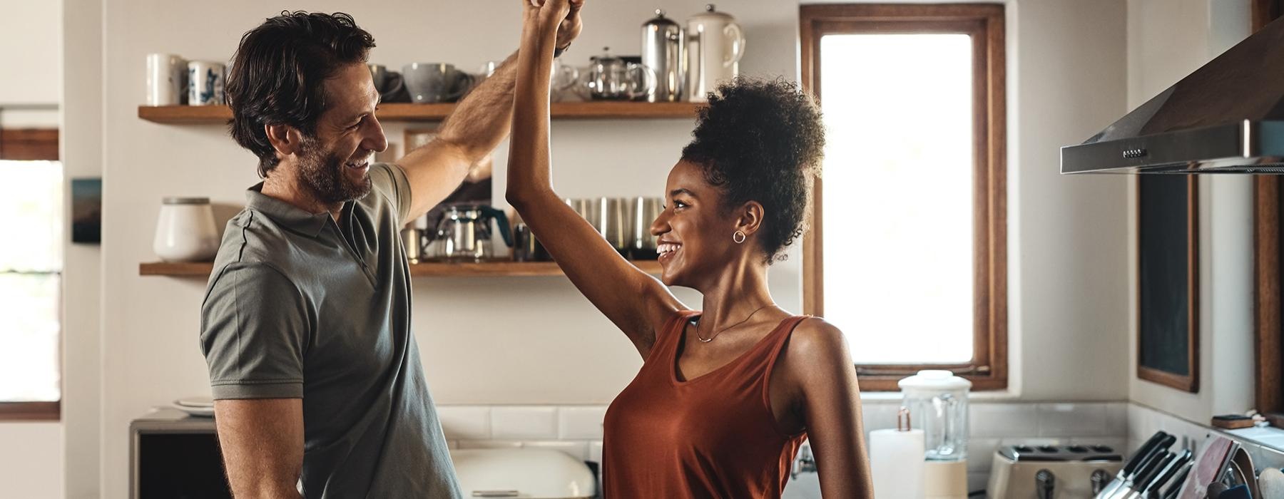 a man and a woman in a kitchen